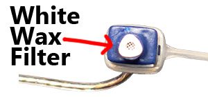 Close up view of hearing aid wax filter in tip of hearing aid speaker
